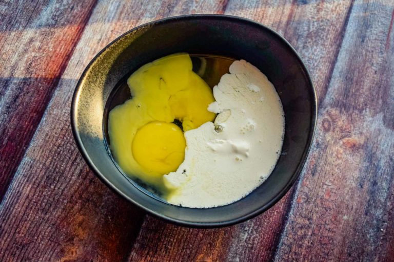 Adding fresh cream to the egg mixture