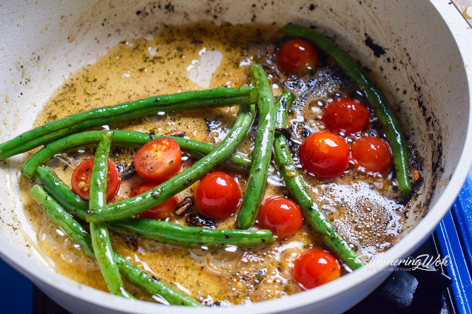 French green beans and cherry tomatoes sauteed in leftover garlic butter sauce